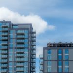 A couple of tall buildings sitting next to each other